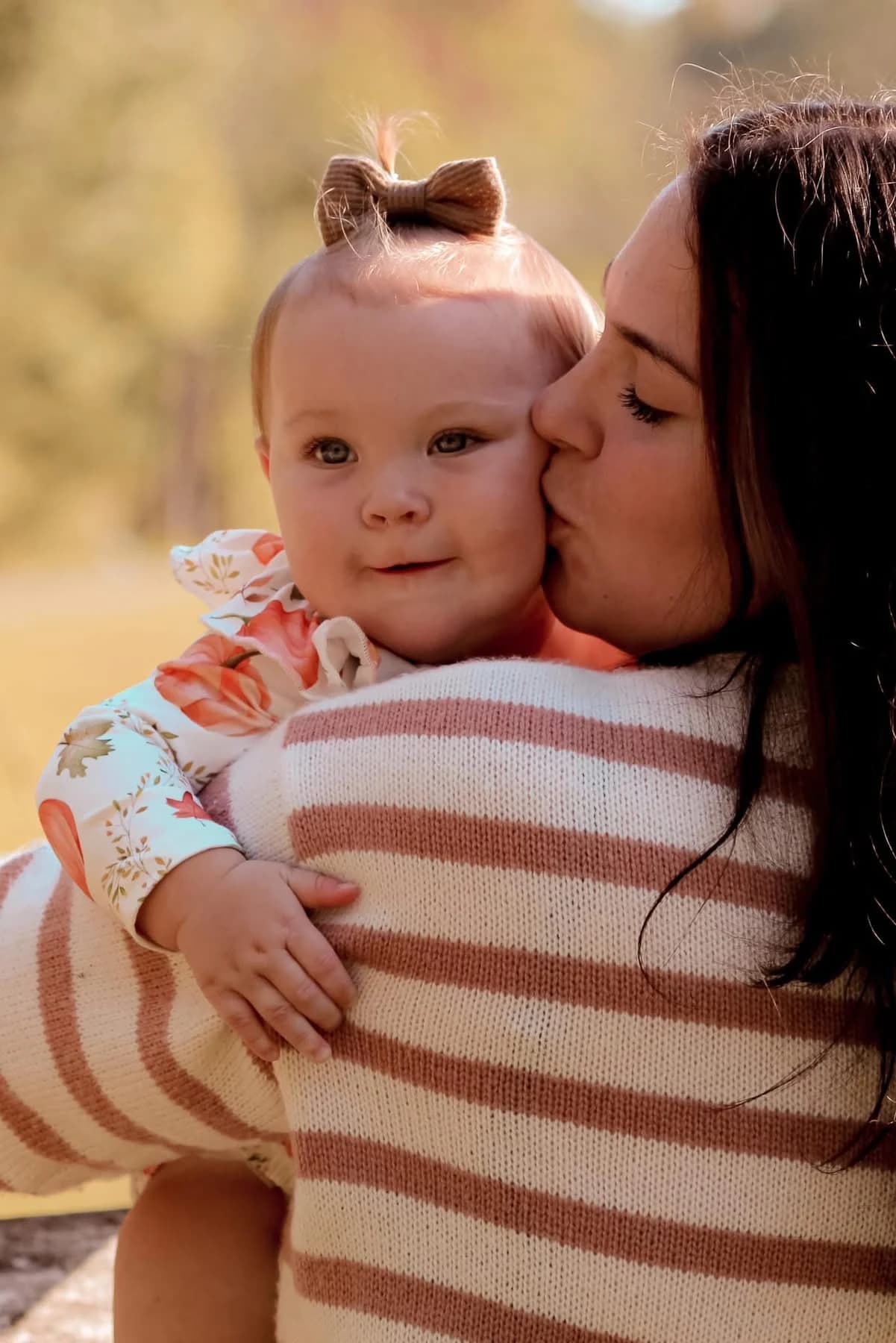 Kinleigh being held by her mother